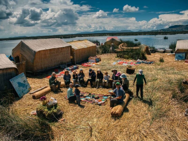 Sunrise over the Chimu floating island with the traditional breakfast prepared by the host families