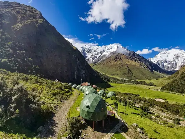 Geodesic Sky Camp domes and Andean Huts lit up at night