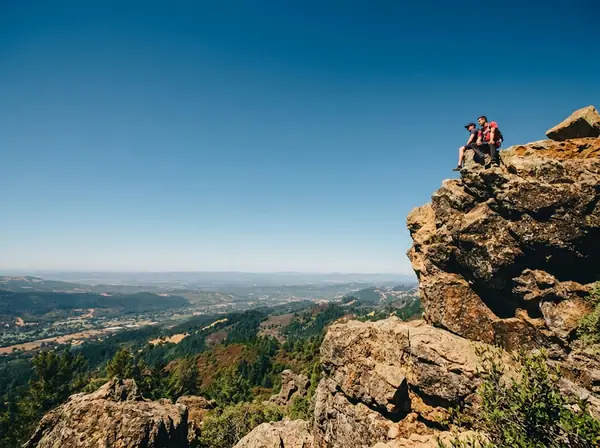 Hikers climbing the shaded trail towards Santa Rosa