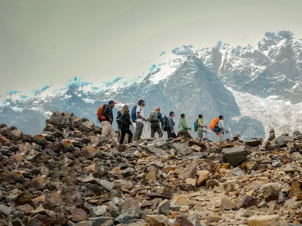Hikers crossing the high Andean puna towards the Salkantay Pass