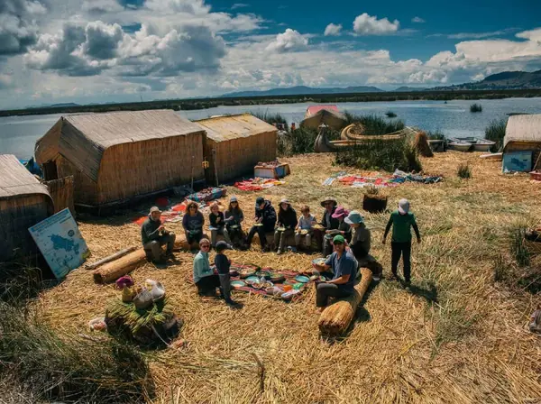 Sunrise over the Chimu floating island with the traditional breakfast prepared by the host families