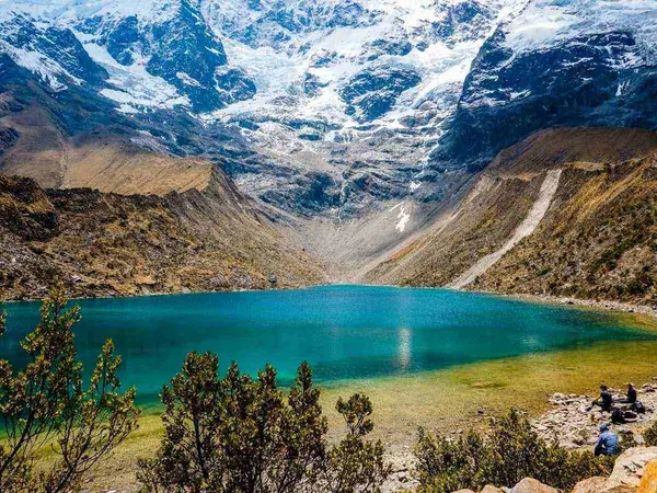 Turquoise water of Humantay Lake with the glacier above