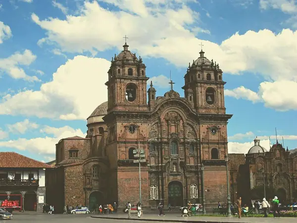 Church of La Compañía de Jesús lit up at night on the Main Square of Cusco
