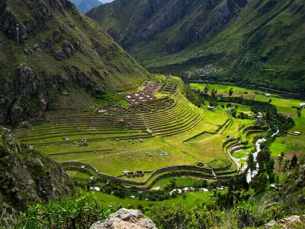 Machu Picchu seen in the distance from the Llactapata archaeological site