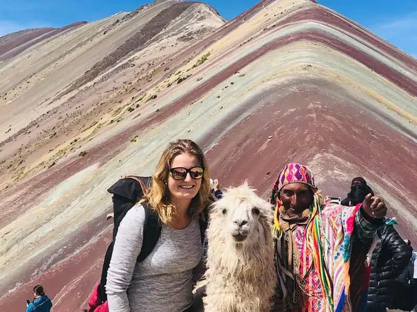 Trail to Vinicunca with hikers and alpacas on the Andean high plateau